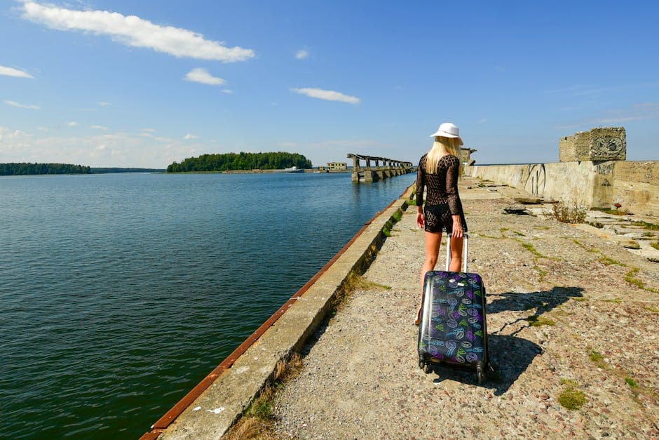 Blonde woman in white hat enjoying sunny day at Hara Submarine Base, Estonia.